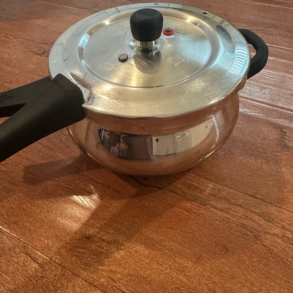 Stainless Steel Pressure Cooker with Black Handles